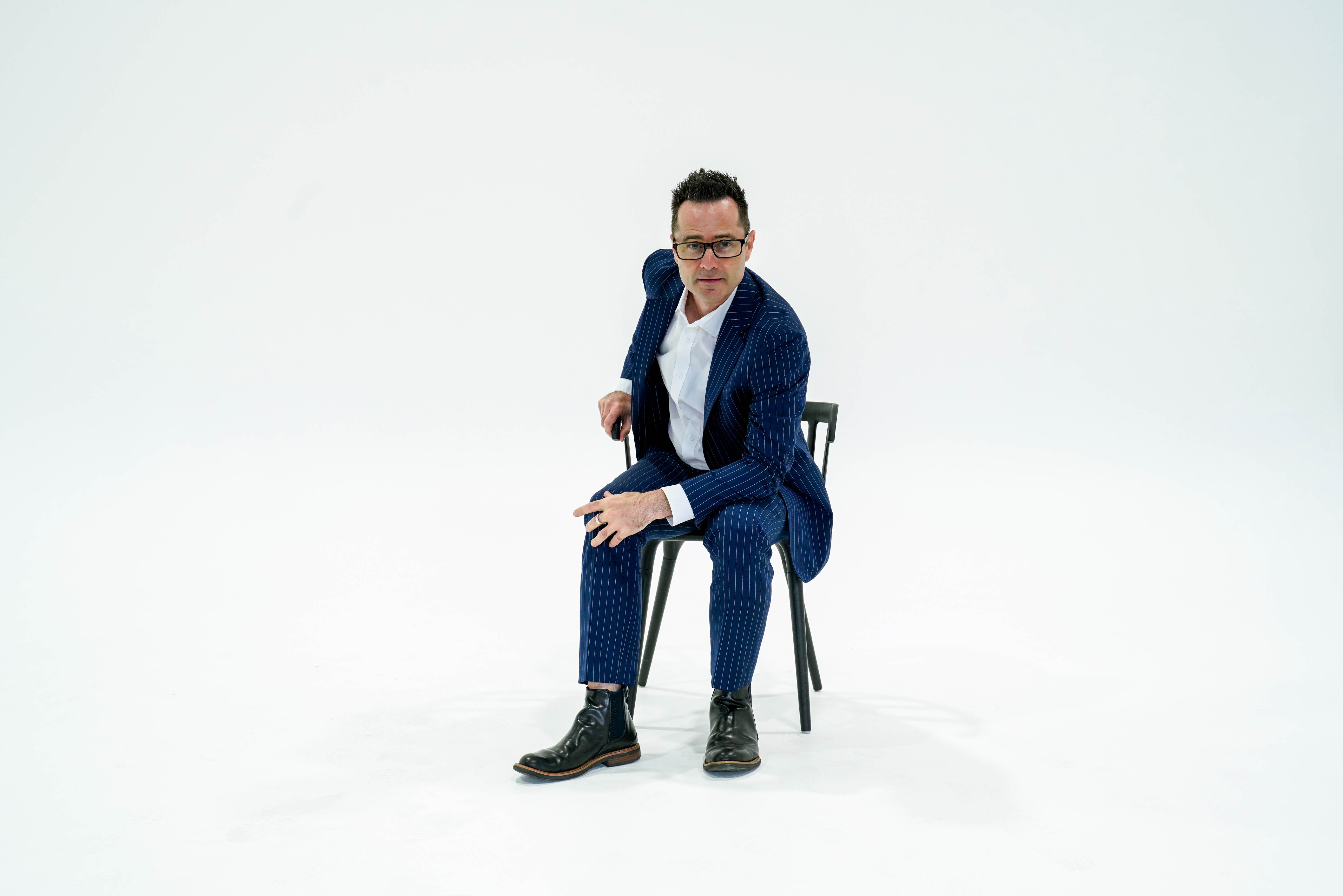 Sam Osborne speaking on stage